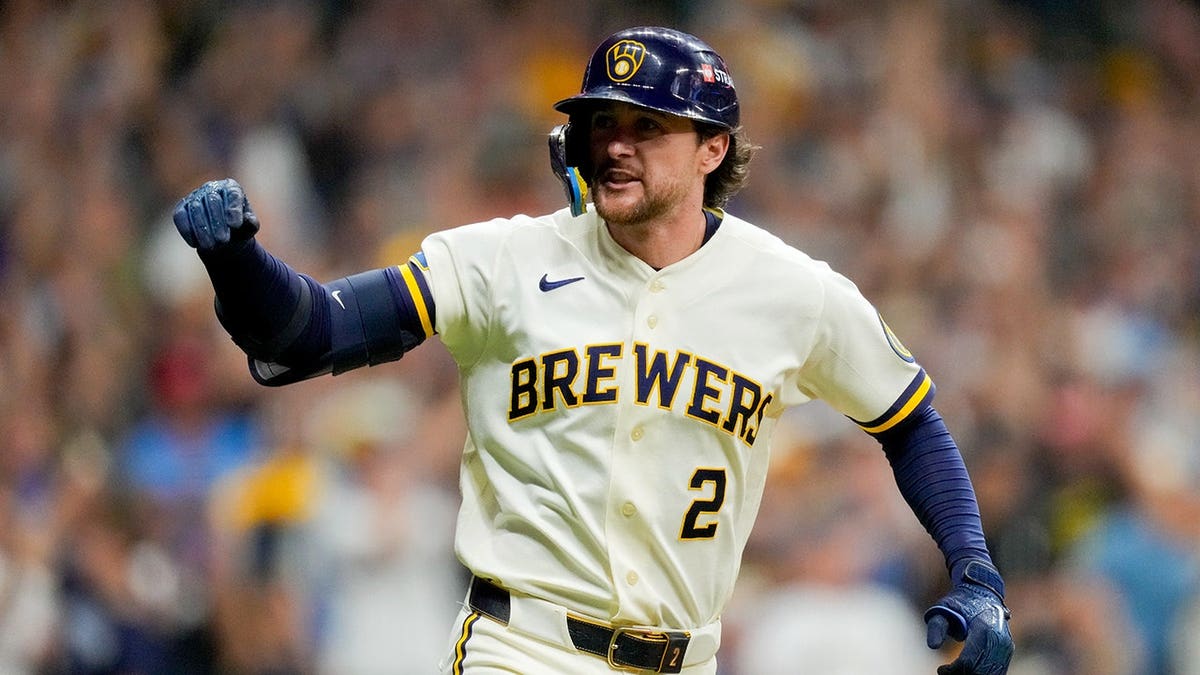 Brice Turang celebrates after an RBI base hit during Game 2 in Milwaukee.