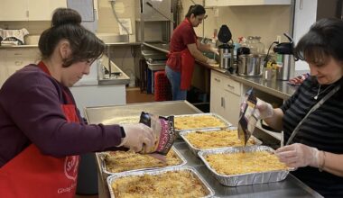 volunteers in kitchen preparing meal