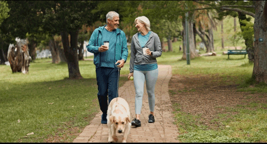Couple exercising - walking dog