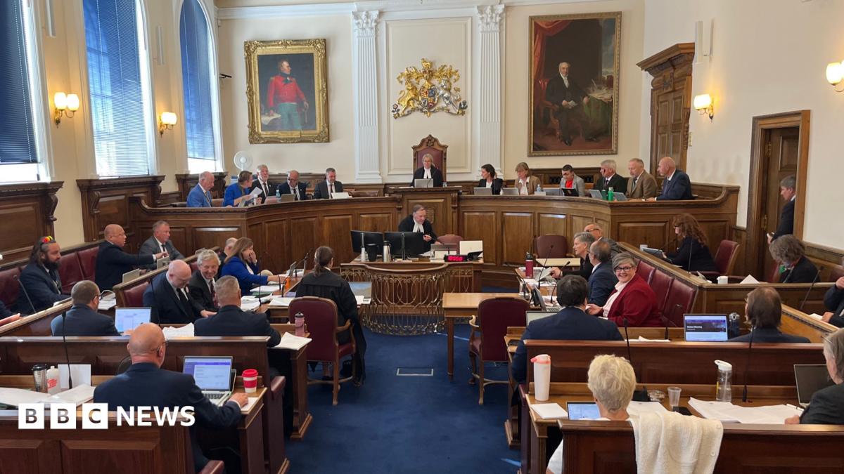Members of the States of Guernsey in the States chambers