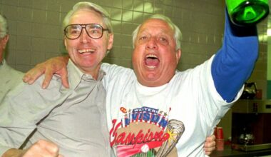 Los Angeles Dodgers executive vice-president Fred Claire, left, and manager Tommy Lasorda celebrate after the Dodgers won the National League West against the Padres, Sept. 30, 1995, in San Diego. (AP Photo/Mike Poche)
