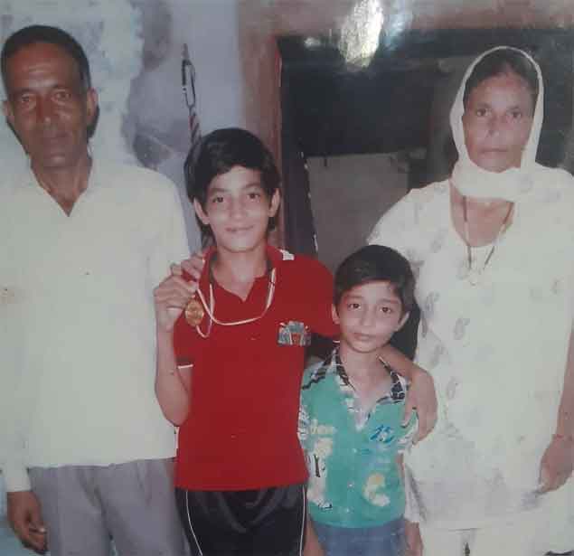 Parveen Hooda with her father, mother and brother (Image credit: Special arrangement) Embed-Parveen-Hooda4-SP