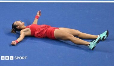 Zheng Qinwen collapses on the court in celebration