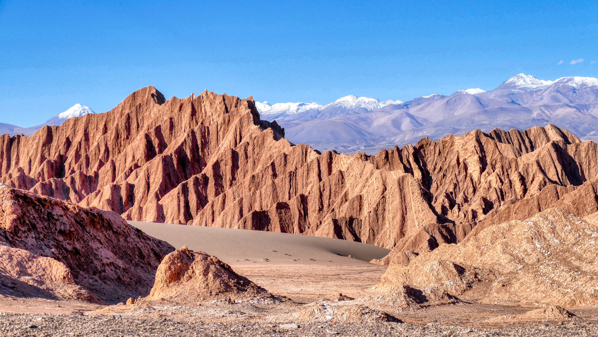 A series of jagged cliffs seen in the desert