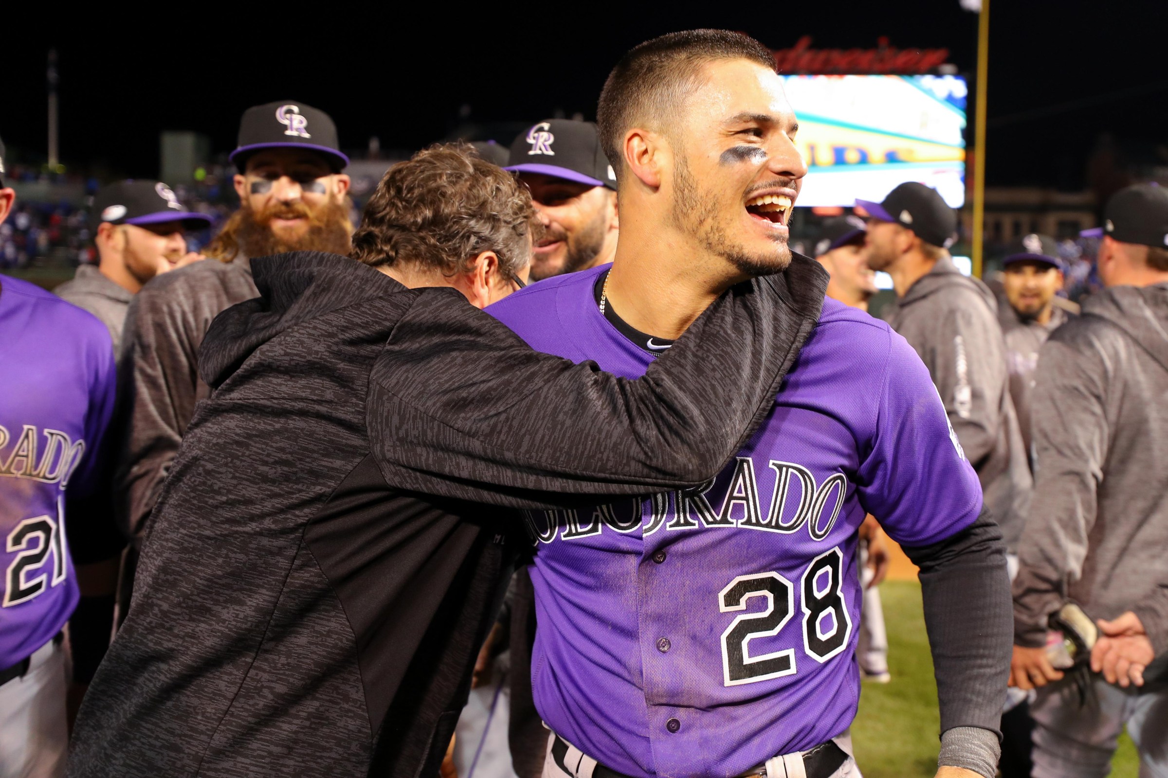 CHICAGO, IL - OCTOBER 2: Nolan Arenado #28 of the Colorado Rockies celebrates with teammates after defeating the Chicago Cubs, 2-1, in 13 innings in the National League Wild Card game against the Chicago Cubs at Wrigley Field on Tuesday, October 2, 2018 in Chicago, Illinois. (Photo by Alex Trautwig/MLB via Getty Images)
