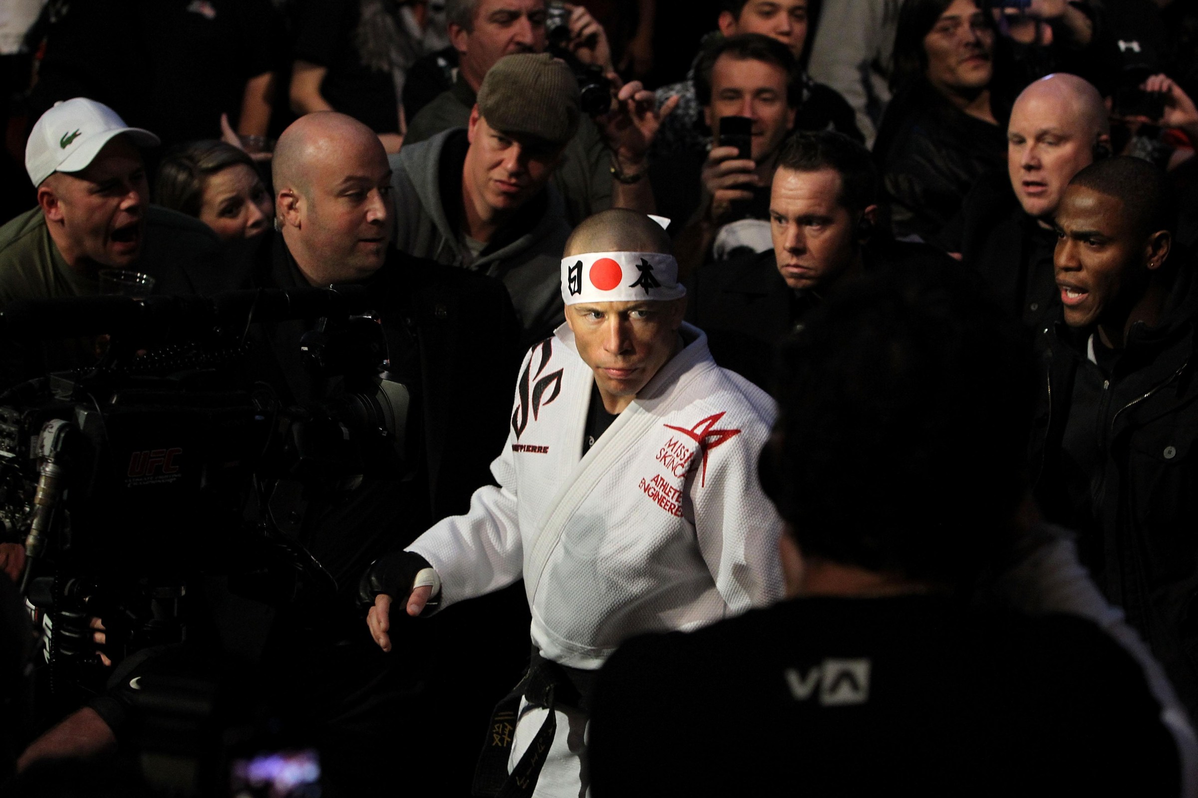 MONTREAL, QC - DECEMBER 11: Georges St-Pierre makes his way to the octagon for his fight against Josh Koscheck during their Welterweight Title bout during UFC 124 at the Centre Bell on December 11, 2010 in Montreal, Quebec, Canada. (Photo by Josh Hedges/Zuffa LLC/Zuffa LLC via Getty Images)
