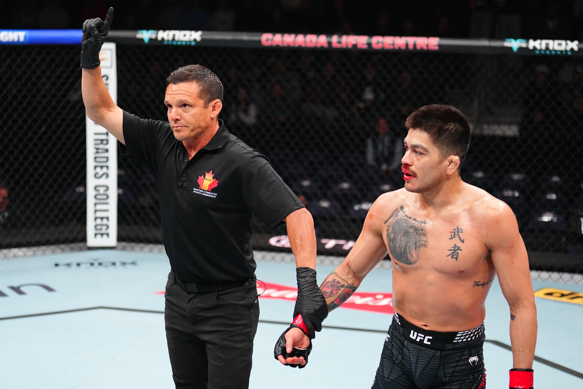 WINNIPEG, MANITOBA - APRIL 18: Referee Jason Herzog deducts a point from John Castaneda after a low blow against Mark Vologdin of Russia in a 139-pound catchweight fight during the UFC Fight Night event at Canada Life Centre on April 18, 2026 in Winnipeg, Manitoba. (Photo by Chris Unger/Zuffa LLC)