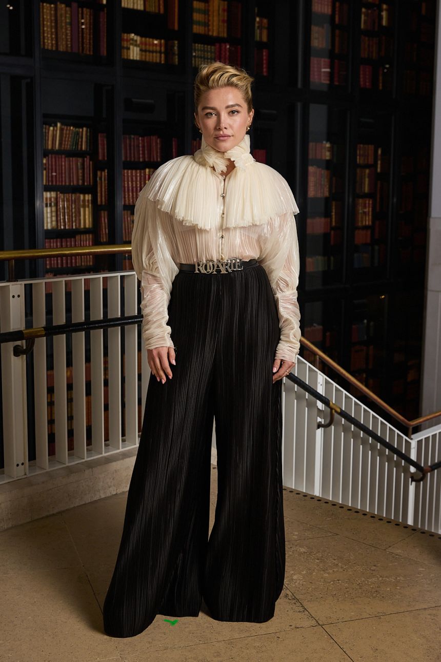 Florence Pugh in elaborate pleats at a photocall for 