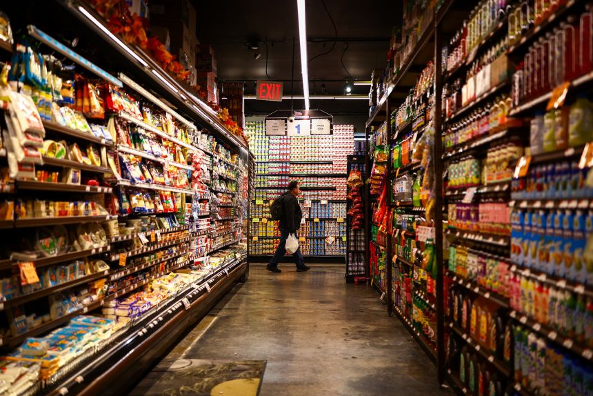 A customer shops in a supermarket in New York on September 28, 2026.