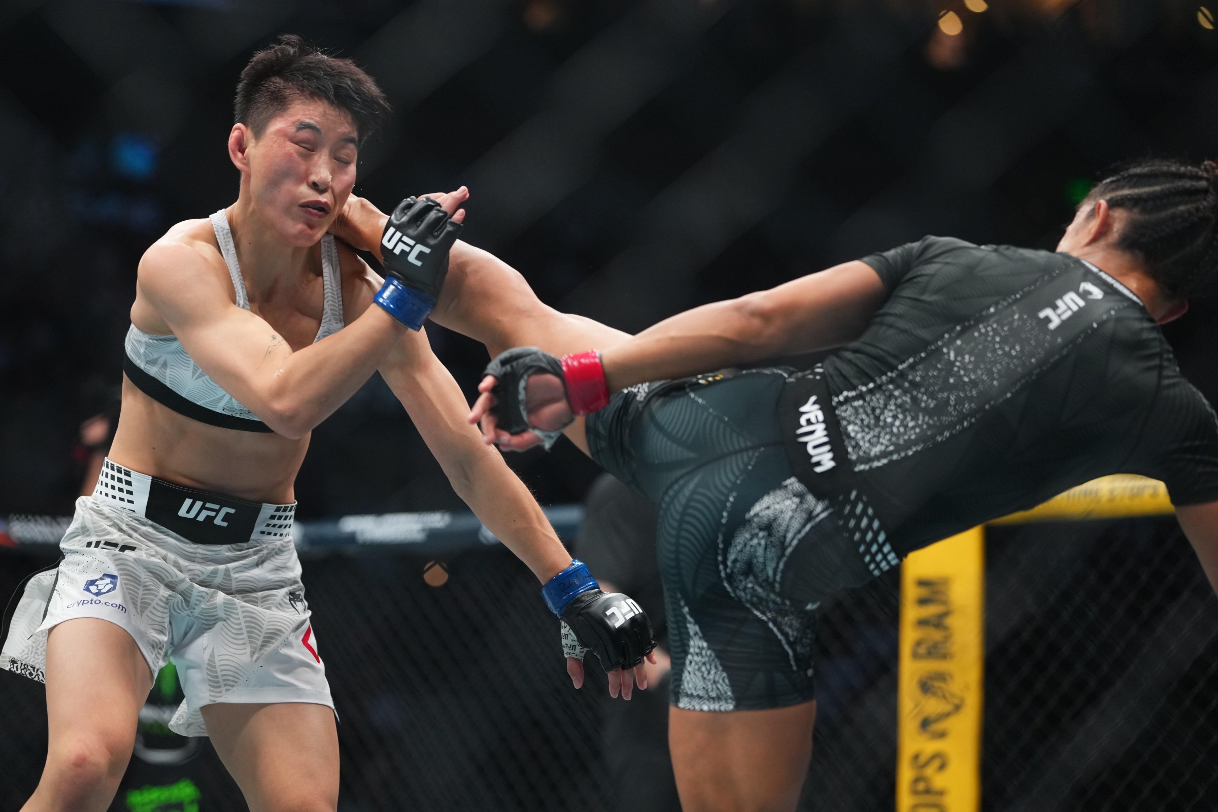 SALT LAKE CITY, UTAH - OCTOBER 03: (R-L) Natalia Silva of Brazil kicks Wang Cong of China in the UFC flyweight championship fight during the UFC 332 event at Delta Center on October 03, 2026 in Salt Lake City, Utah. (Photo by Cooper Neill/Zuffa LLC)