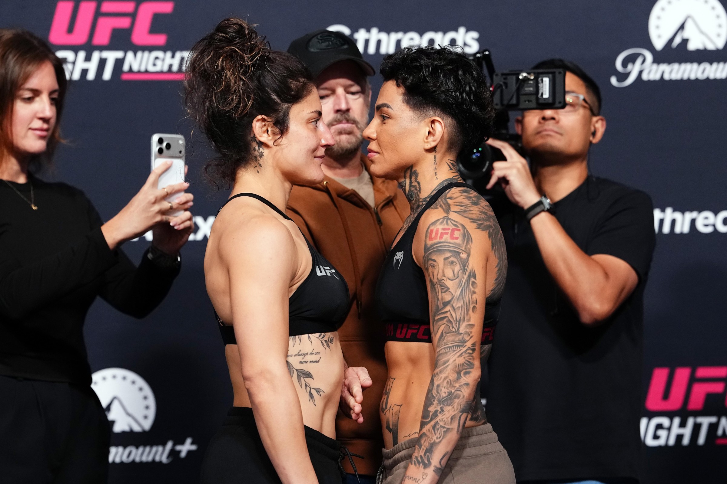 LAS VEGAS, NEVADA - OCTOBER 09: (L-R) Loopy Godinez of Mexico and Ketlen Souza of Brazil face off during the UFC Fight Night weigh-in event at Meta APEX on October 09, 2026 in Las Vegas, Nevada. (Photo by Jeff Bottari/Zuffa LLC)
