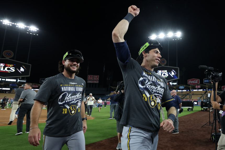 The Milwaukee Brewers' Christian Yelich raises a fist after the Brewers clinched their first World Series appearance since 1982.