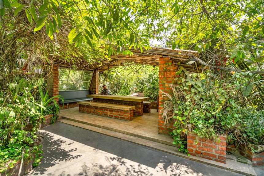 A shaded eating area in the factory's gardens.
