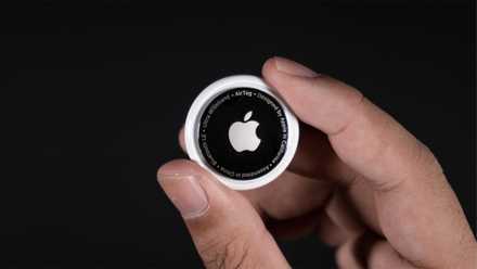 Holding an Apple AirTag