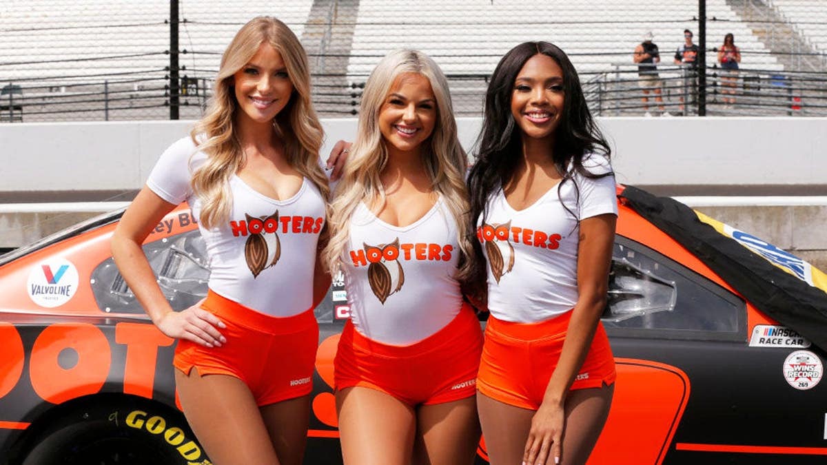 Hooters girls stand on pit lane at Indianapolis Motor Speedway.