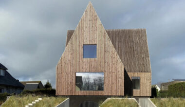 four pitched-roof volumes build timber-clad coastal house in belgium