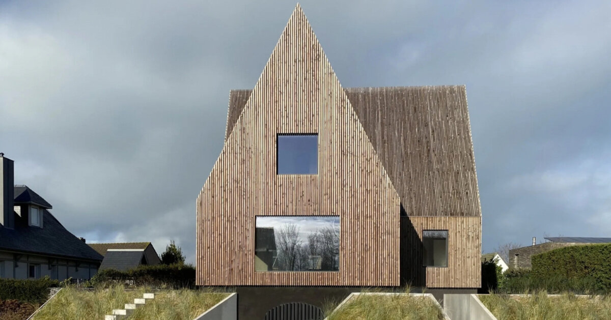 four pitched-roof volumes build timber-clad coastal house in belgium