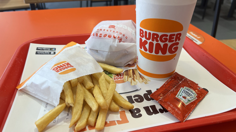 Burger King medium fries with restaurant blurred in background