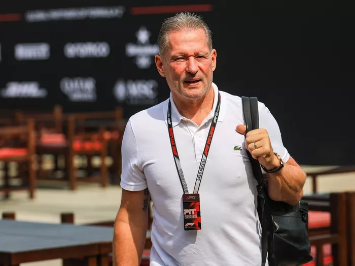 Jos Verstappen walks in the paddock.