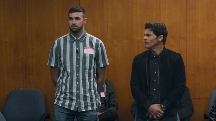 Ronald Gladden and James Marsden stand in a jury room in a production still from Jury Duty on Prime Video.