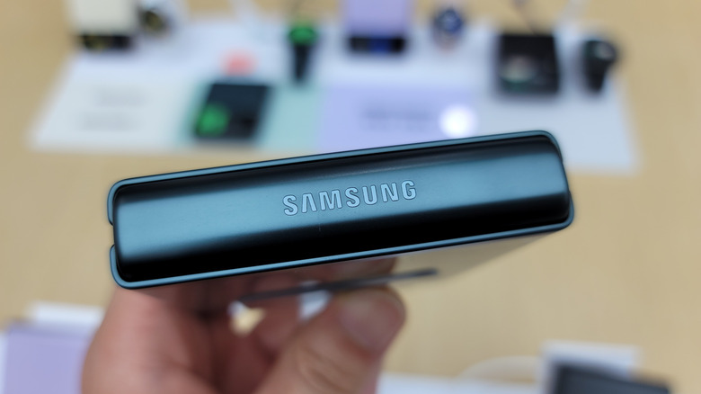 Close-up of a Samsung foldable phone hinge with the Samsung logo visible.