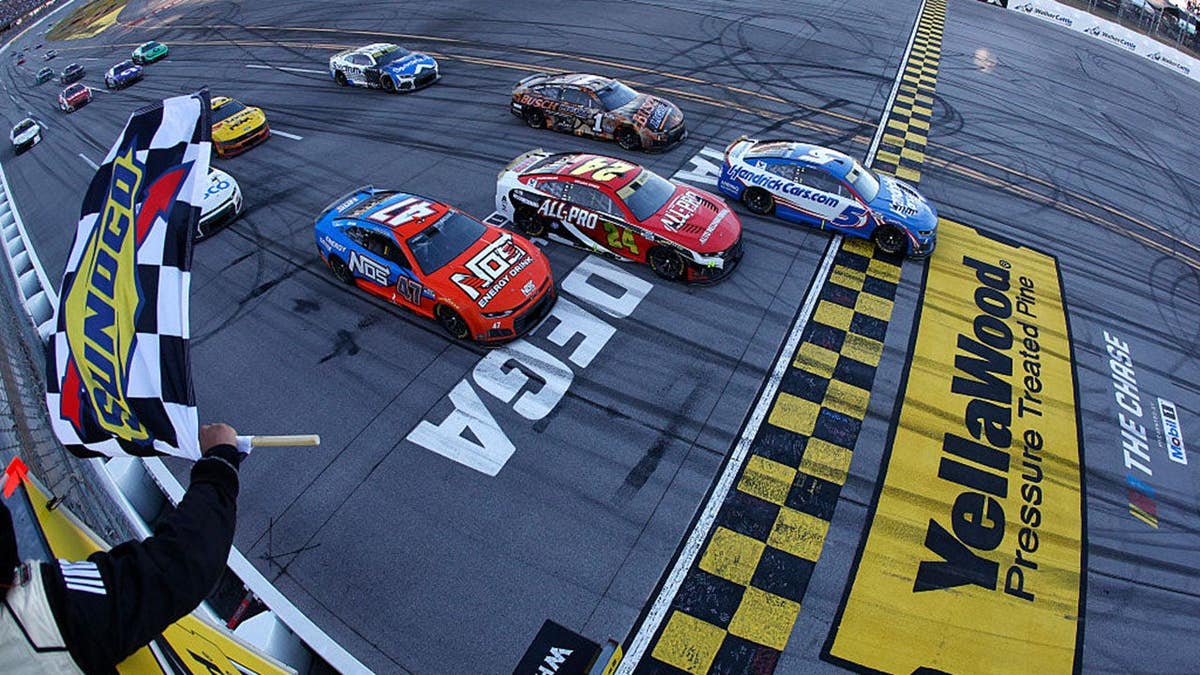 Kyle Larson takes the checkered flag at Talladega Superspeedway.