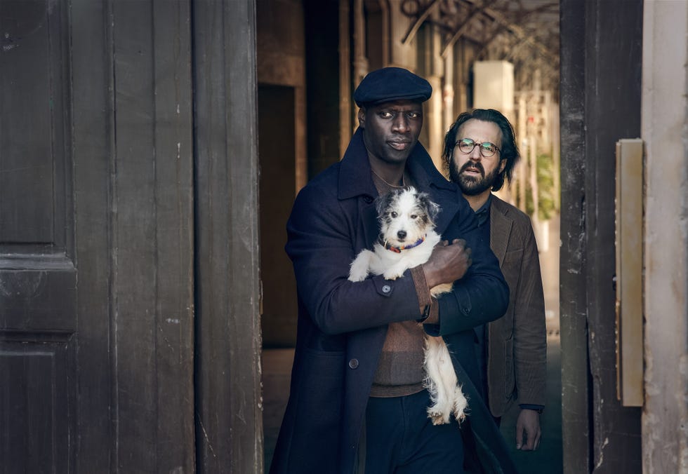 Assane and J'Accuse in Lupin omar sy as assane diop with dog jaccuse in lupin
