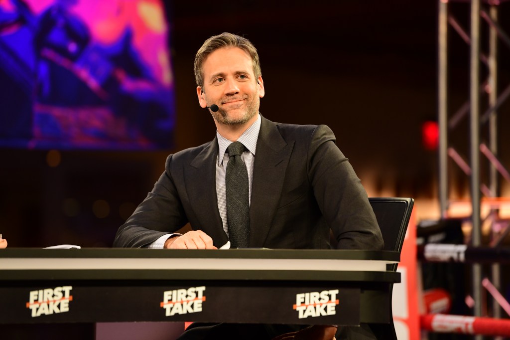 Max Kellerman sitting on the set of First Take.