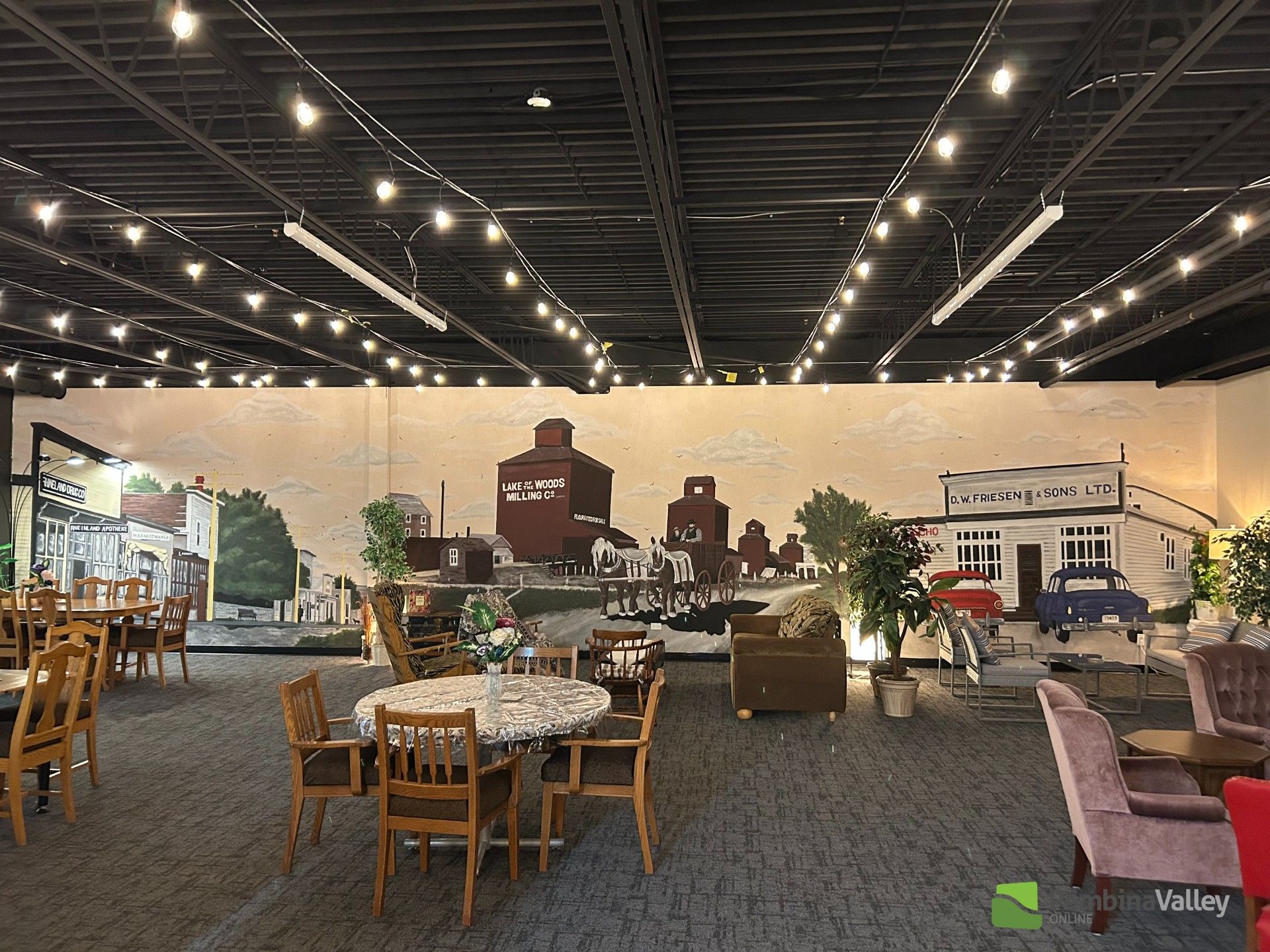 A photo of the mural at the grand opening of the Love Well Drop-in Centre