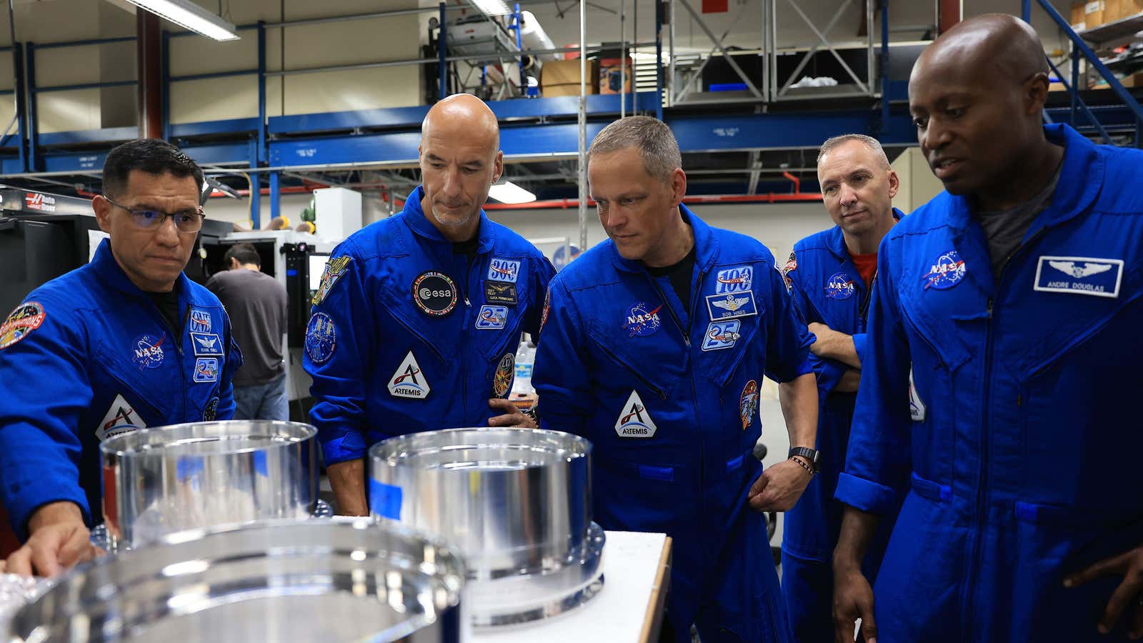 In this photo provided by NASA, from left, NASA astronaut Frank Rubio, ESA (European Space Agency) astronaut Luca Parmitano, and NASA astronauts Bob Hines, Randy Bresnik, and Andre Douglas visit the Prototype Development Laboratory at NASA's Kennedy Space Center in Florida on Wednesday, Sept. 2, 2026.