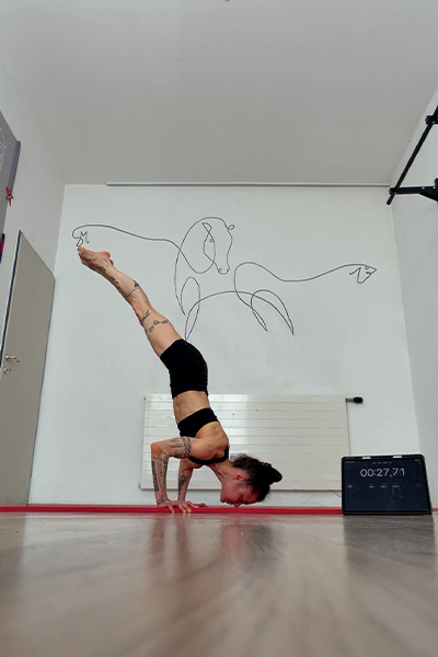 Stefanie doing a handstand push up