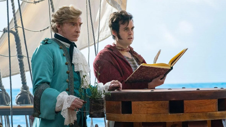 Rhys Darby as Captain Stede Bonnet and Nathan Foad as Lucius Spriggs, surveying the ocean in Our Flag Means Death.