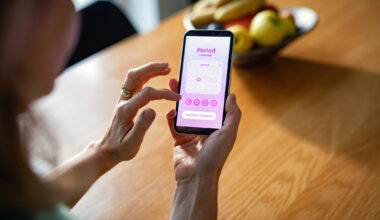 A person tracking their period on an app on their smartphone.