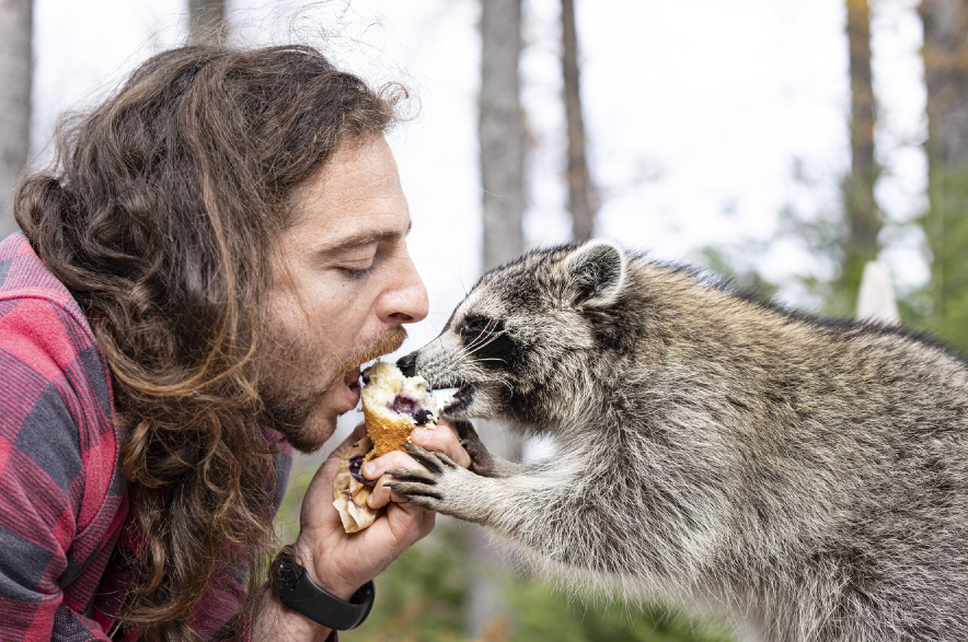 Louka Berman and his pet raccoon Pepper.