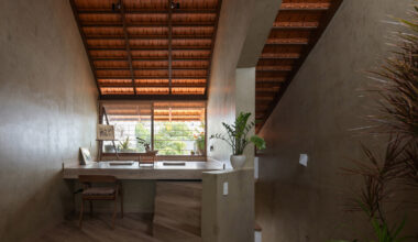 Terracotta tiles enclose skinny Roof House in Vietnam
