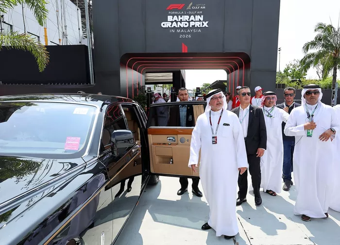 Salman bin Hamad Al Khalifa arrives in the paddock.