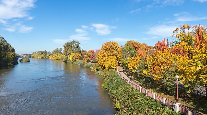The Willamette River flowing beside a riverside path in Eugene, Oregon