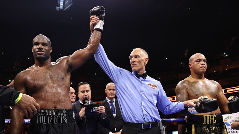 Dubois has his hand raised in victory. (Photos: Leigh Dawney/Queensberry Promotions)