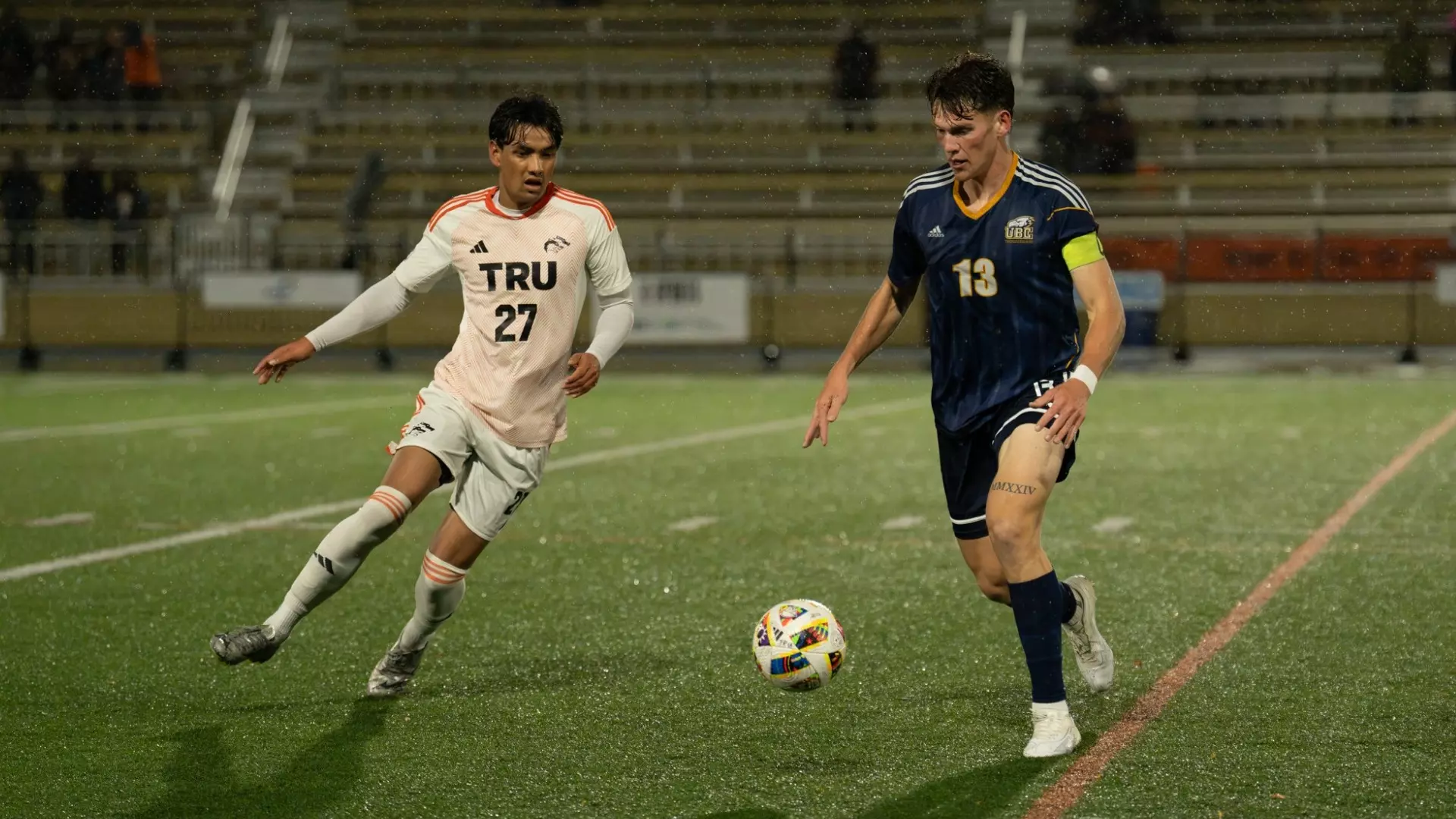 Eric Lajeunesse has the ball at his feet while a defender runs towards him