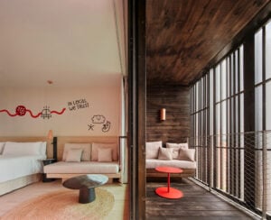 Bedroom and balcony in Terreno Barrio Hotel in Palma by OHLAB