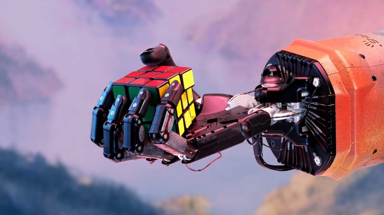 OpenAI's robotic hand holding a Rubik's Cube.