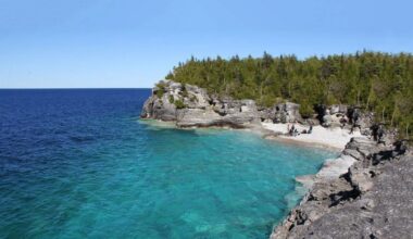Blue Georgian Bay and limestone escarpment of Bruce Peninsula National Park.