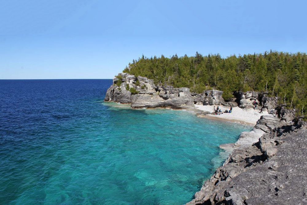 Blue Georgian Bay and limestone escarpment of Bruce Peninsula National Park.