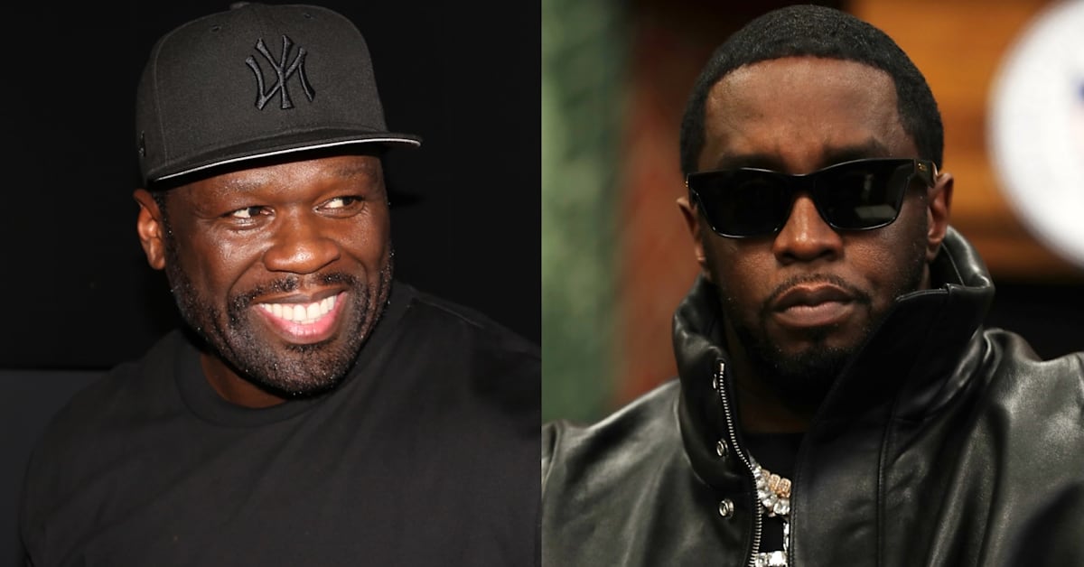 50 Cent wearing a black cap and a "Vuitton" shirt, holding a microphone, with a food platter in the background.