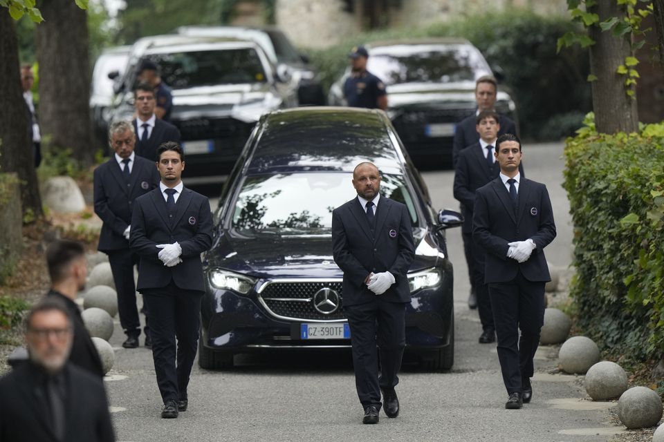 The hearse leaves at the end of designer Giorgio Armani’s funeral in the San Martino church in the small historic village of Rivalta (Luca Bruno/AP)
