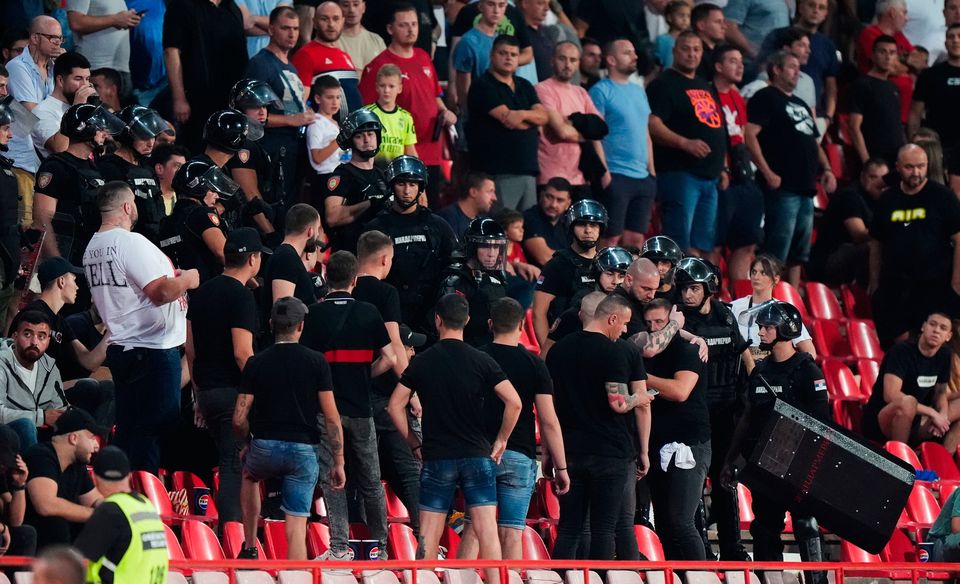 Riot police in the stands with Serbia fans in Belgrade. Photo: Bradley Collyer/PA Wire