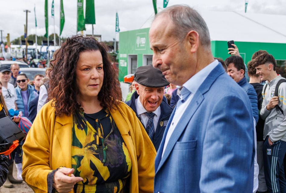 Taoiseach Micheál Martin shares a joke with Minister Micheal Healy Rae at day one of the National Ploughing Championships in Screggan, Tullamore, Co. Offaly. Pic: Mark Condren