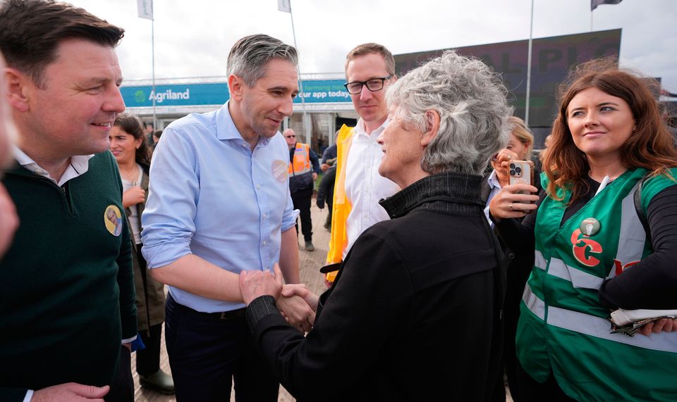 Tánaiste Simon Harris meets Independent Presidential candidate Catherine Connolly at the National Ploughing Championships at Tullamore, Co  Offaly. Pic: Niall Carson/PA Wire