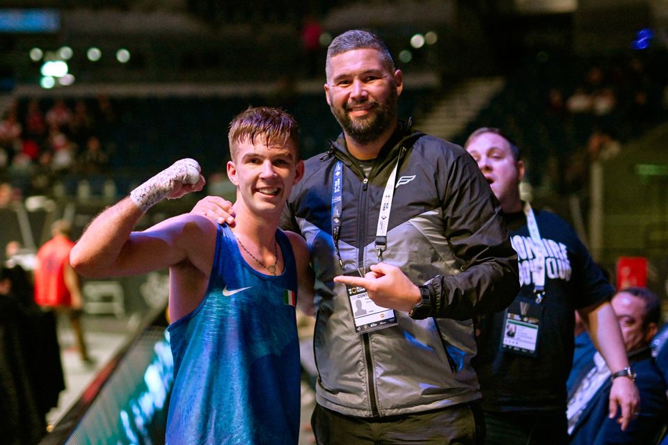 Patsy Joyce celebrates his quarter-final victory in Liverpool with former professional world champion Tony Bellew. Photo: Ben McShane/Sportsfile