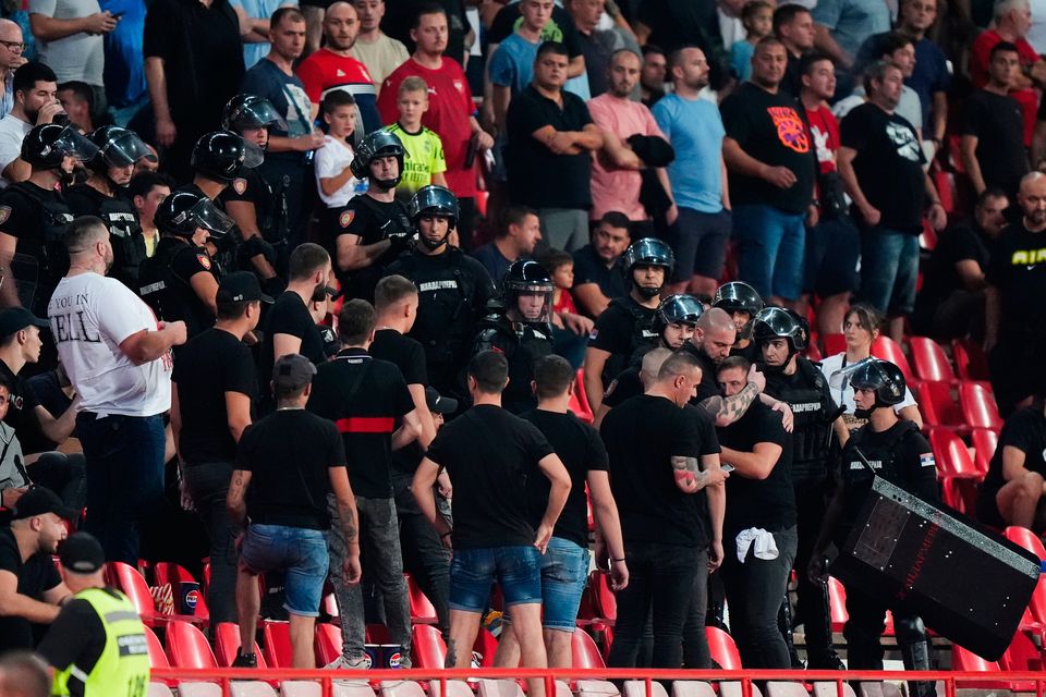 Riot police in the stands with Serbia fans in Belgrade. Photo: Bradley Collyer/PA Wire